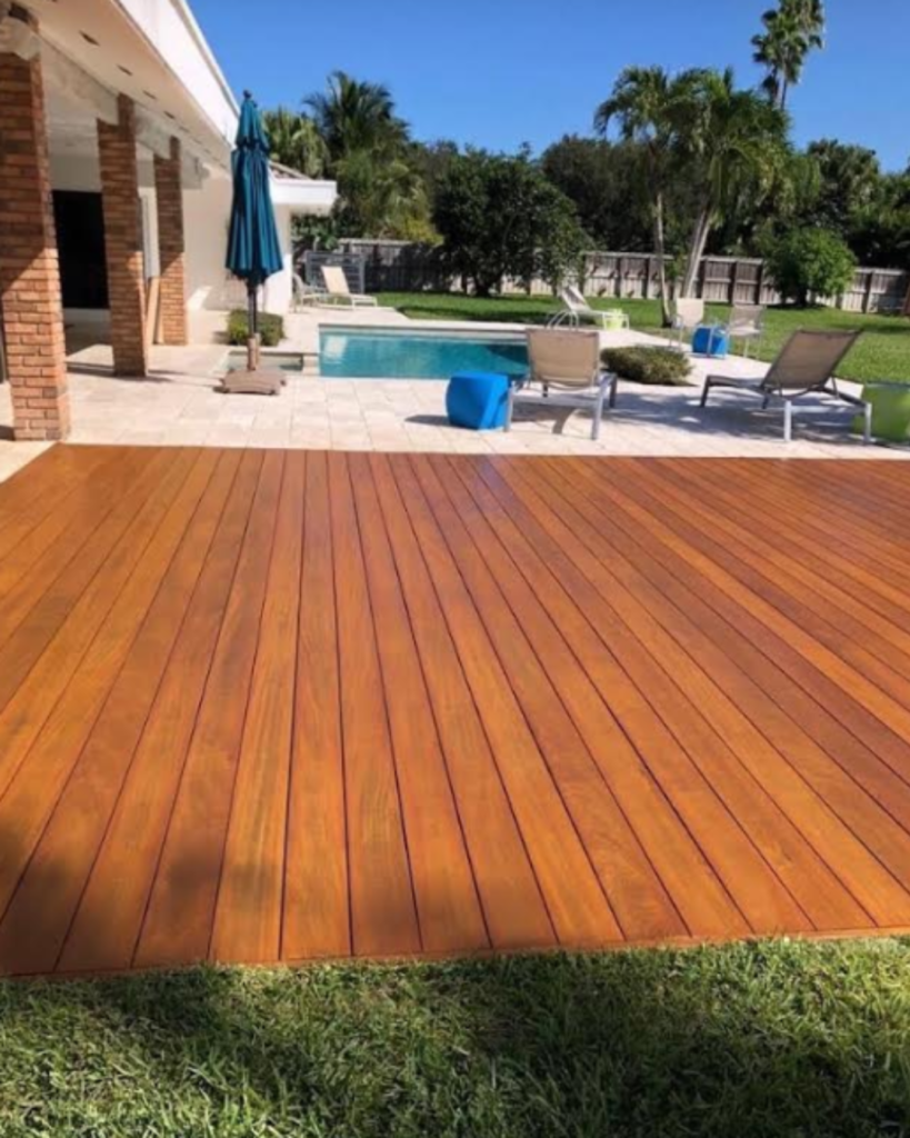 Cumaru wood pool deck in Malibu backyard with modern patio and lounge chairs